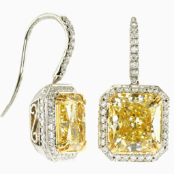 A Radiant 3.01ct Fancy Yellow VS1 and 2.84ct Fancy Yellow IF Diamond Earrings set