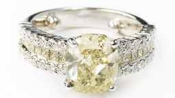 A 3.09ct Cushion Shaped Fancy Grayish-Greenish-Yellow Diamond Set In 18K White Gold Ring