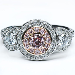 A 0.31ct Round Shaped Fancy Pink Diamond Set In 18K White Gold Ring