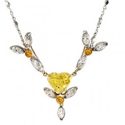 2.01ct Heart Shaped Fancy Intense Yellow Diamond. Surrounded by three flower petals with deep orangy yellow diamonds and white marquise diamonds, 2.07ctw. Made in 18K WG.