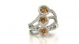 (3) Round Champagne Diamonds, 0.49ctw. With 132 F-G VS accent diamonds, 1.11ctw. Made in 18K white gold.